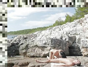 Zesty russian brunette taissia shanti makes love on the rocky beach