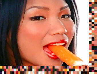 Asian babe is eating ice cream before masturbating