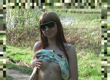 Cute teen flashes shaved vagina outdoors