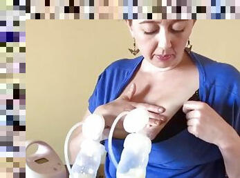 Homely milf shows how to pump milk out of both tits
