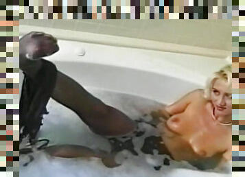 Sexy blonde enjoys warm bath