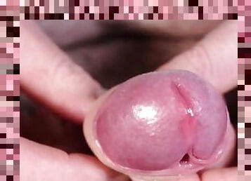 Extreme close up and slow motion while playing with small penis exposing head getting erect