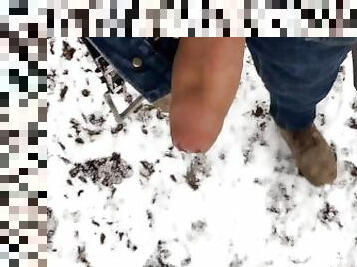 Cumming while walking in the frozen land