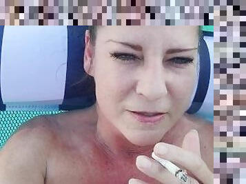 Smoking naked milf using dildo to cream and squirt in pool