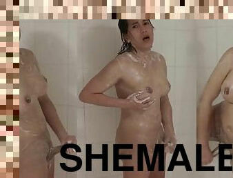 Hot shemale masturbates with soap in the shower