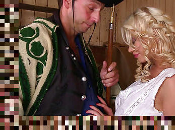 Cute curly blonde is giving a blowjob in the hayloft