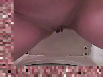 Sexy small tits brunette pees in toilet