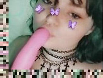 Goth chick sucks on her toy