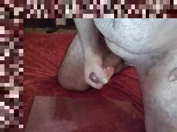 I jerk off, have a big load and play with the cum with my feet.