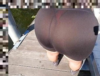 Spandex shorts visible red thong at docks