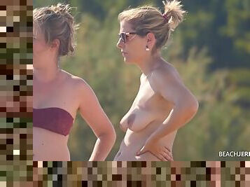 Topless milf and her pregnant friend at the beach